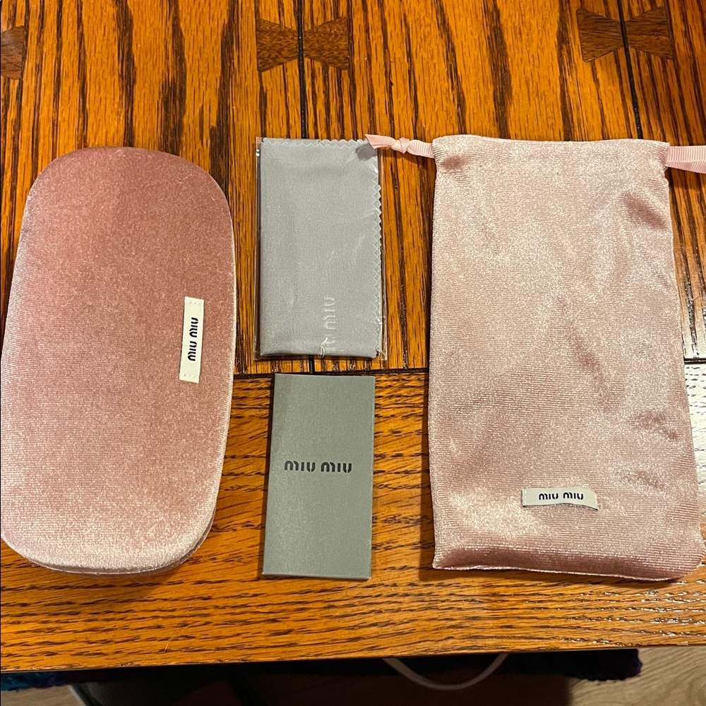 Miu Miu pink sunglasses case with bag and cleaning cloth unused